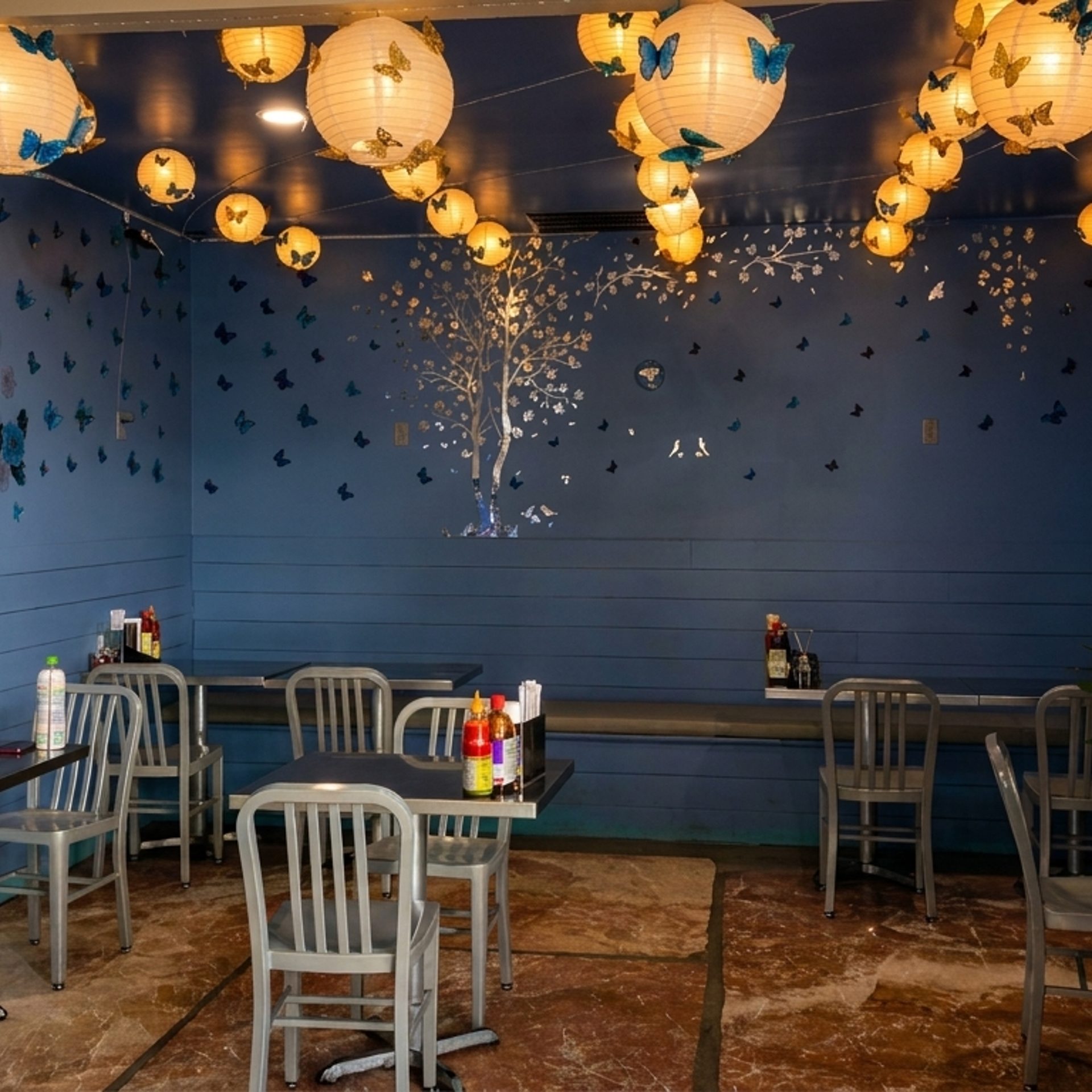 Blue Walls, Paper Lanterns, Patio Out Front