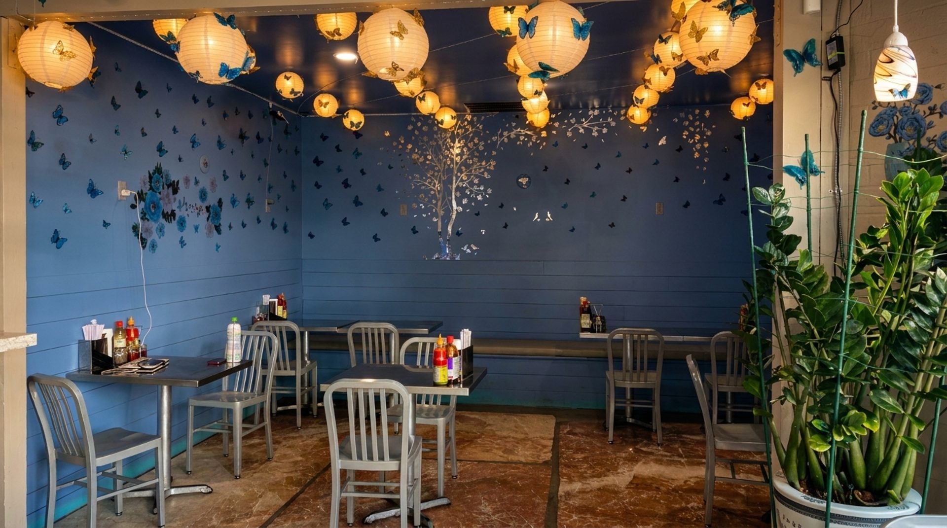 Blue Walls, Paper Lanterns, Patio Out Front